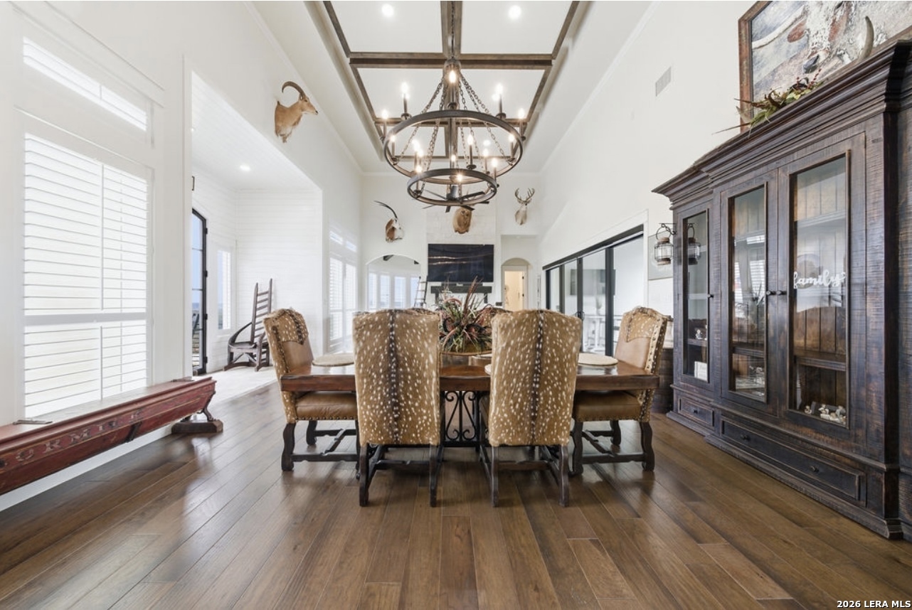 5920 Verden Ridge New Braunfels, TX 78132 - Photo 15 of 61 a view of a dining room with furniture window and wooden floor