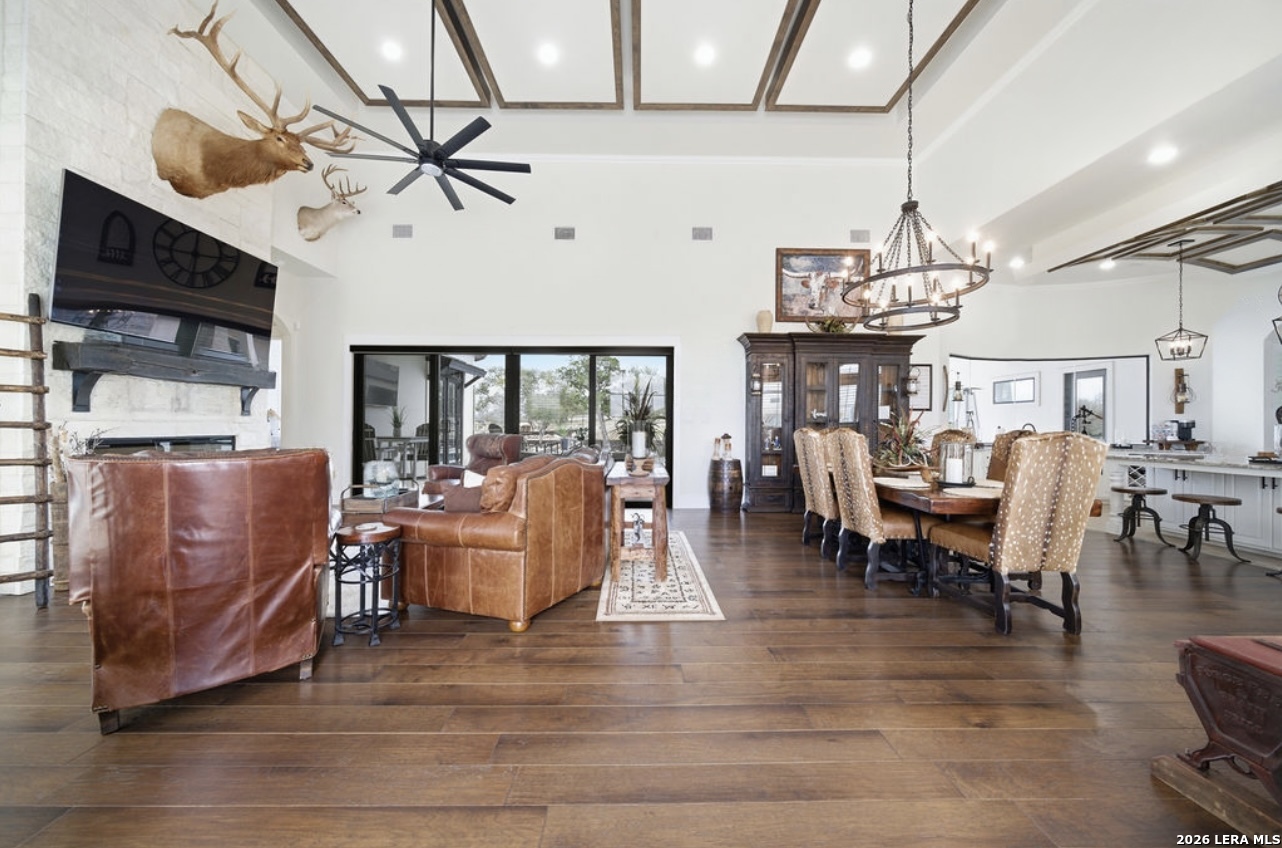 5920 Verden Ridge New Braunfels, TX 78132 - Photo 17 of 61 a living room with lots of furniture and a chandelier