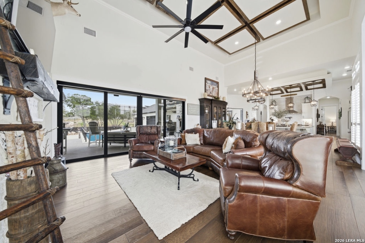 5920 Verden Ridge New Braunfels, TX 78132 - Photo 19 of 61 a living room with lots of furniture and a large window