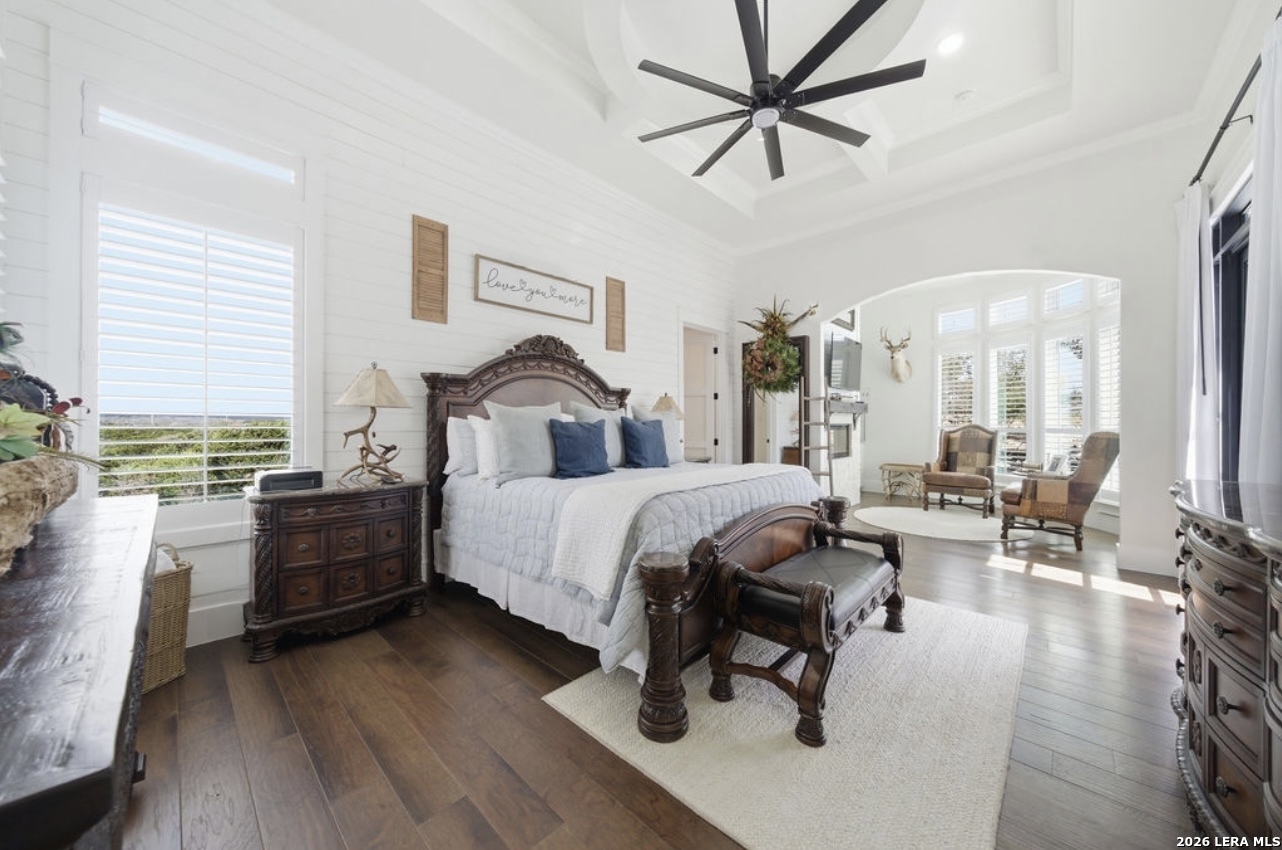 5920 Verden Ridge New Braunfels, TX 78132 - Photo 20 of 61 a spacious bedroom with a bed and a chandelier