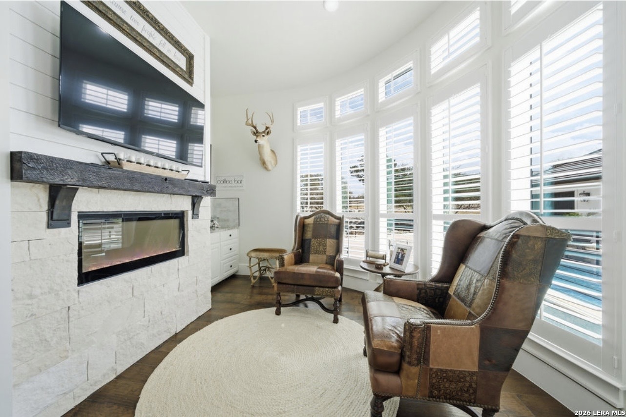 5920 Verden Ridge New Braunfels, TX 78132 - Photo 21 of 61 a living room with furniture and a fireplace