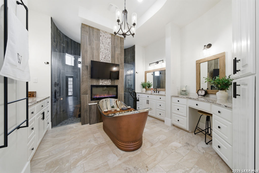 5920 Verden Ridge New Braunfels, TX 78132 - Photo 24 of 61 a room with cabinets and flat screen tv
