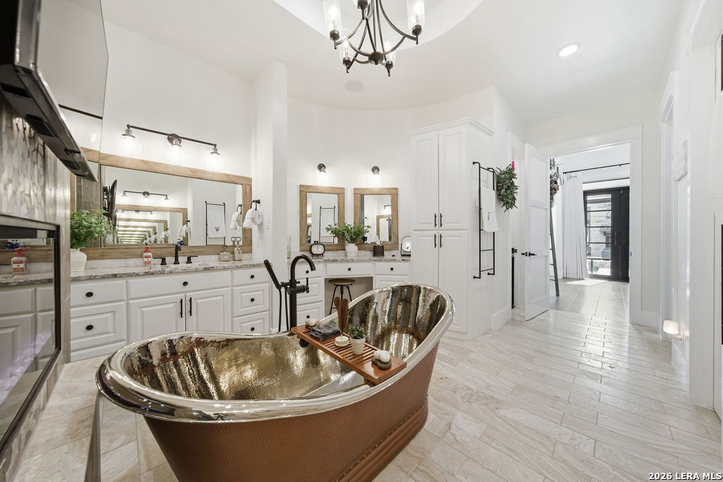 5920 Verden Ridge New Braunfels, TX 78132 - Photo 25 of 61 a living room with furniture a fireplace and kitchen view