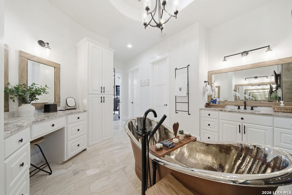 5920 Verden Ridge New Braunfels, TX 78132 - Photo 26 of 61 a kitchen with granite countertop a sink appliances and cabinets