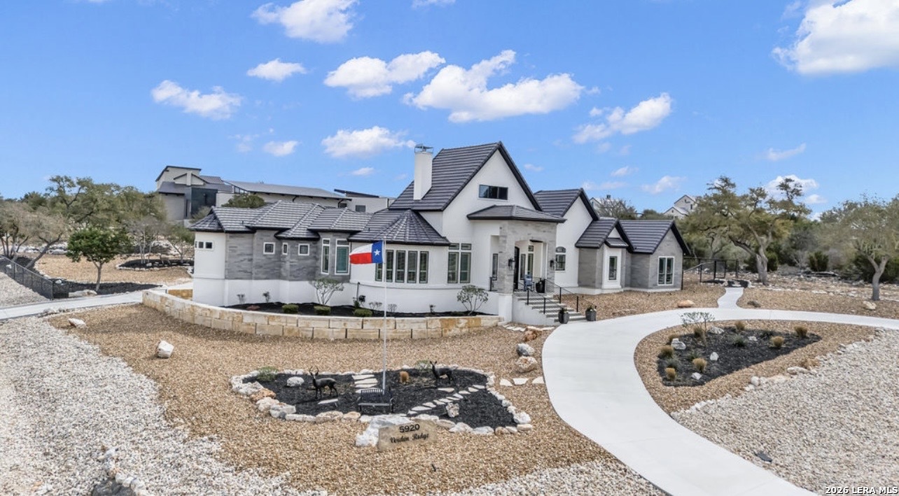 5920 Verden Ridge New Braunfels, TX 78132 - Photo 3 of 61 a front view of a house with a yard