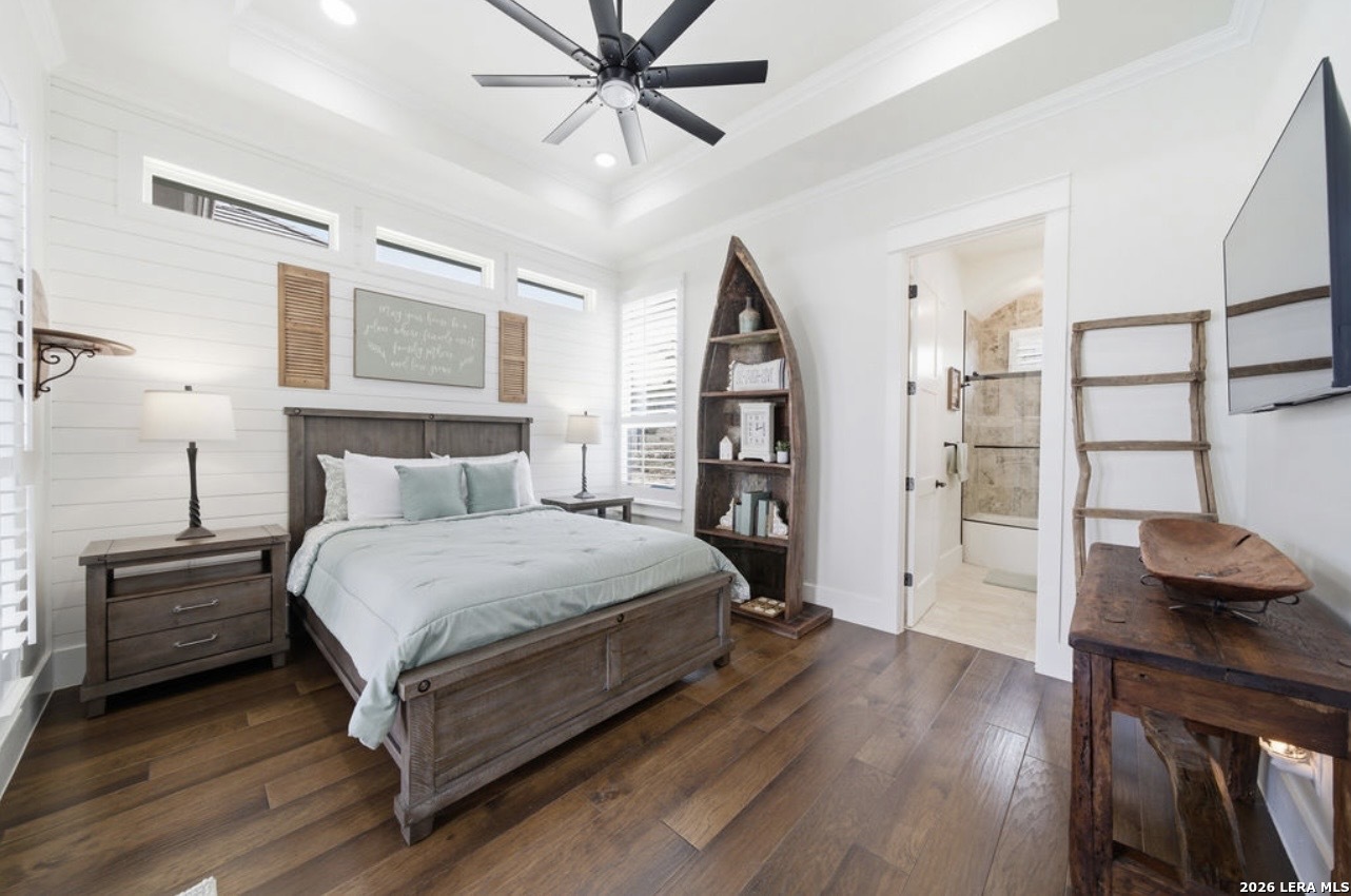 5920 Verden Ridge New Braunfels, TX 78132 - Photo 31 of 61 a bedroom with a bed and wooden floor