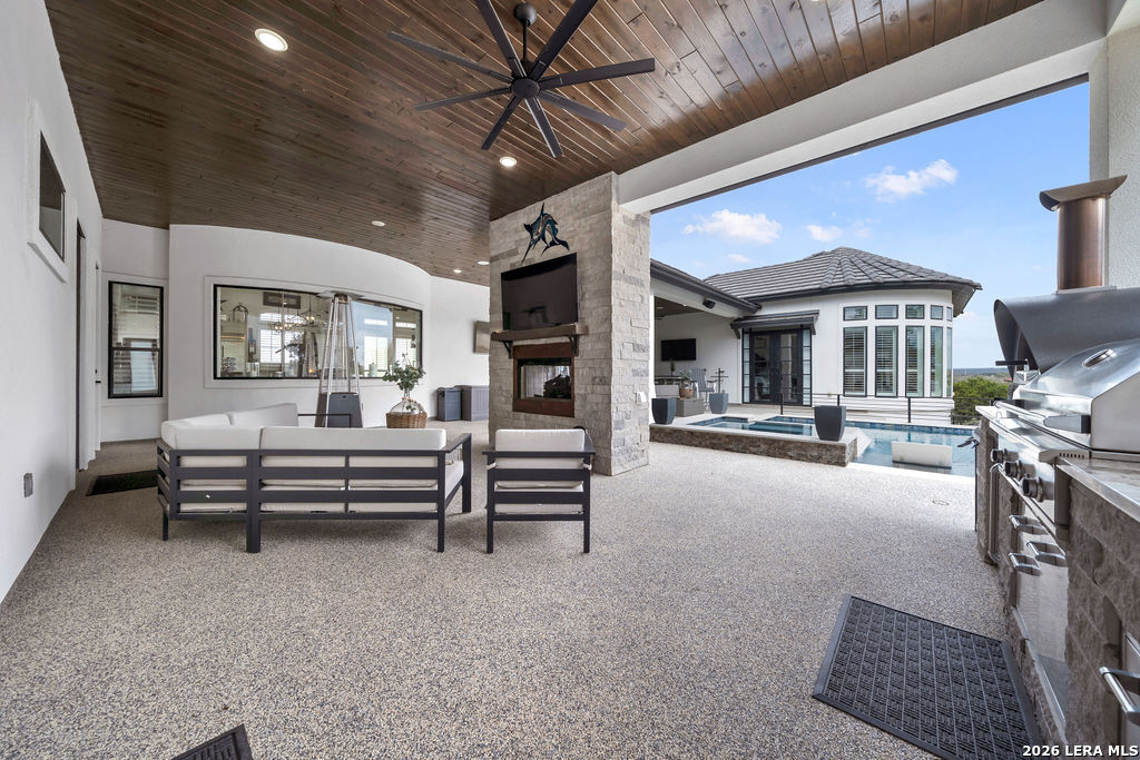 5920 Verden Ridge New Braunfels, TX 78132 - Photo 43 of 61 a living room with furniture and a flat screen tv
