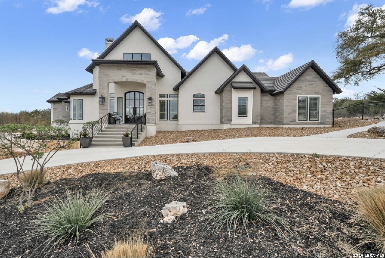 5920 Verden Ridge New Braunfels, TX 78132 - Photo 5 of 61 a front view of a house with a yard