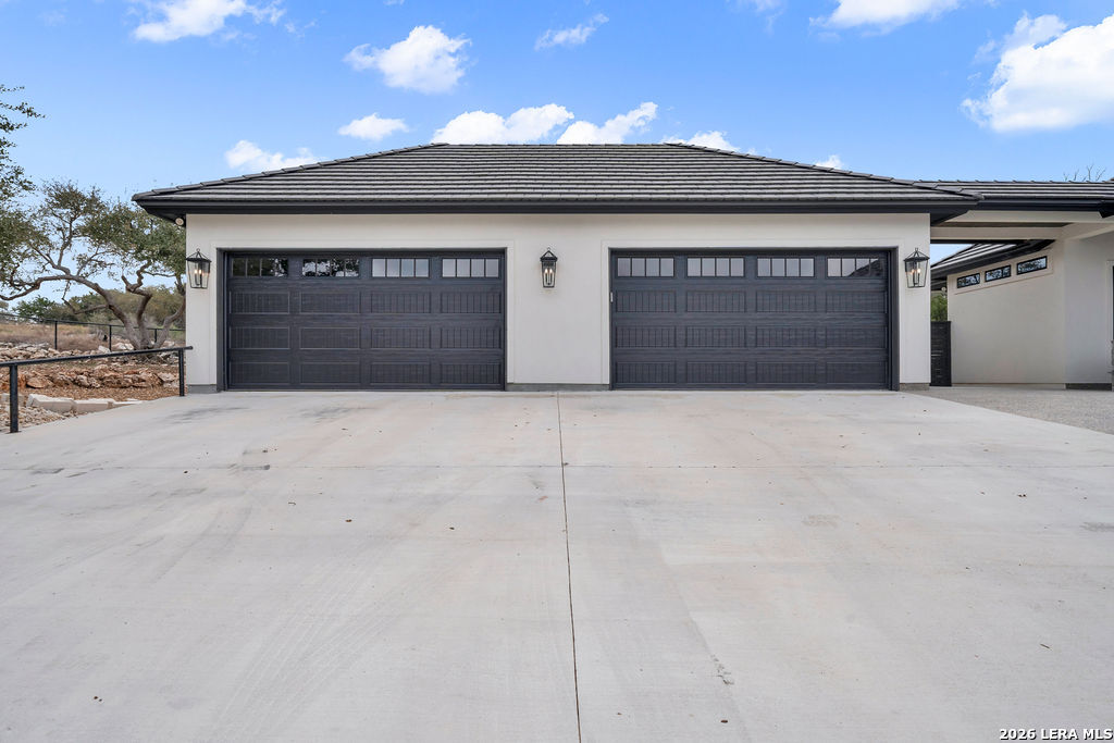 5920 Verden Ridge New Braunfels, TX 78132 - Photo 51 of 61 a view of garage with a fireplace