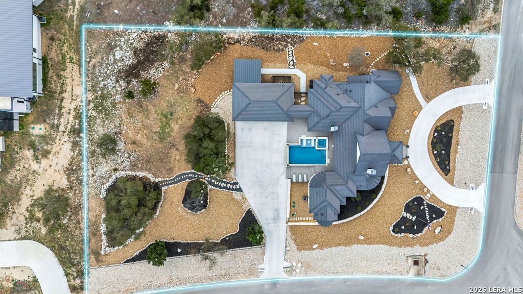 5920 Verden Ridge New Braunfels, TX 78132 - Photo 55 of 61 an aerial view of a house with swimming pool and large trees