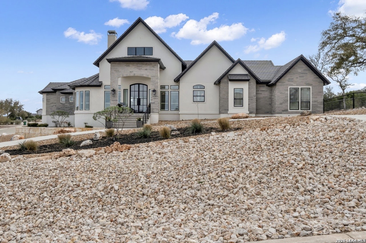 5920 Verden Ridge New Braunfels, TX 78132 - Photo 57 of 61 a front view of a house with a yard