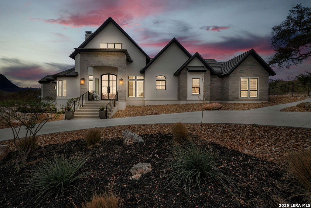 5920 Verden Ridge New Braunfels, TX 78132 - Photo 58 of 61 a front view of a house with a yard