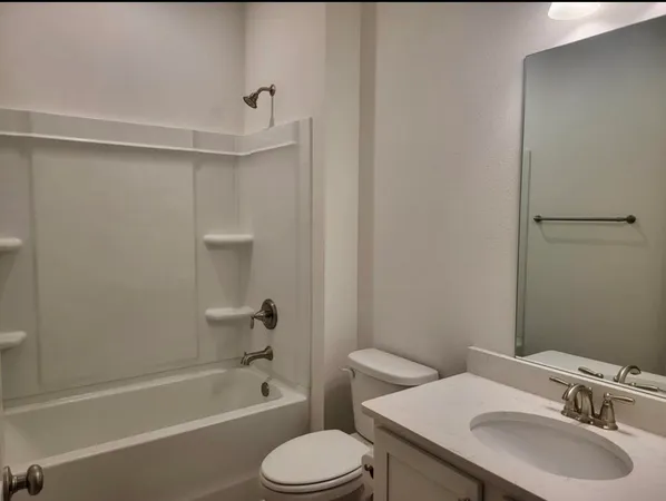 a bathroom with a sink toilet and bathtub