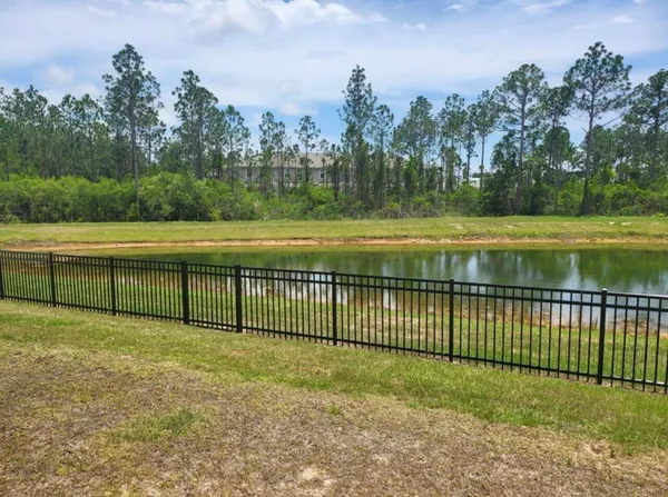 a view of a yard with a lake view