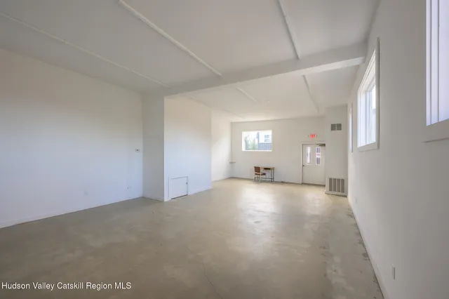 a view of a street with sitting area