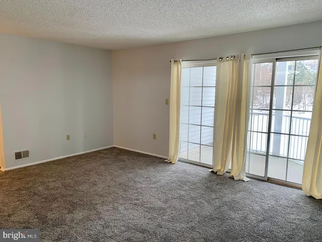 an empty room with a fireplace