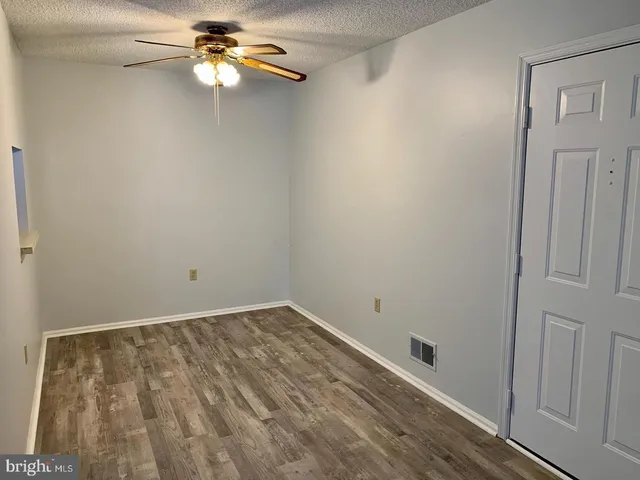 a view of room with a fan and a fan