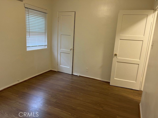 3909 Glen Way El Monte, CA 91731 - Photo 15 of 22 an empty room with wooden floor and cabinet
