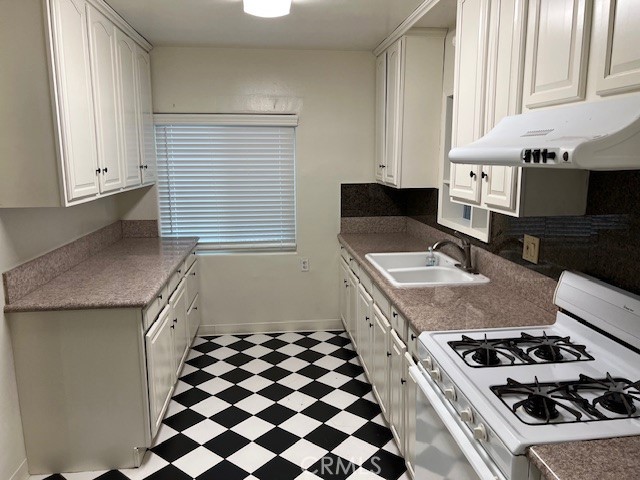 3909 Glen Way El Monte, CA 91731 - Photo 8 of 22 a kitchen with a stove and a sink