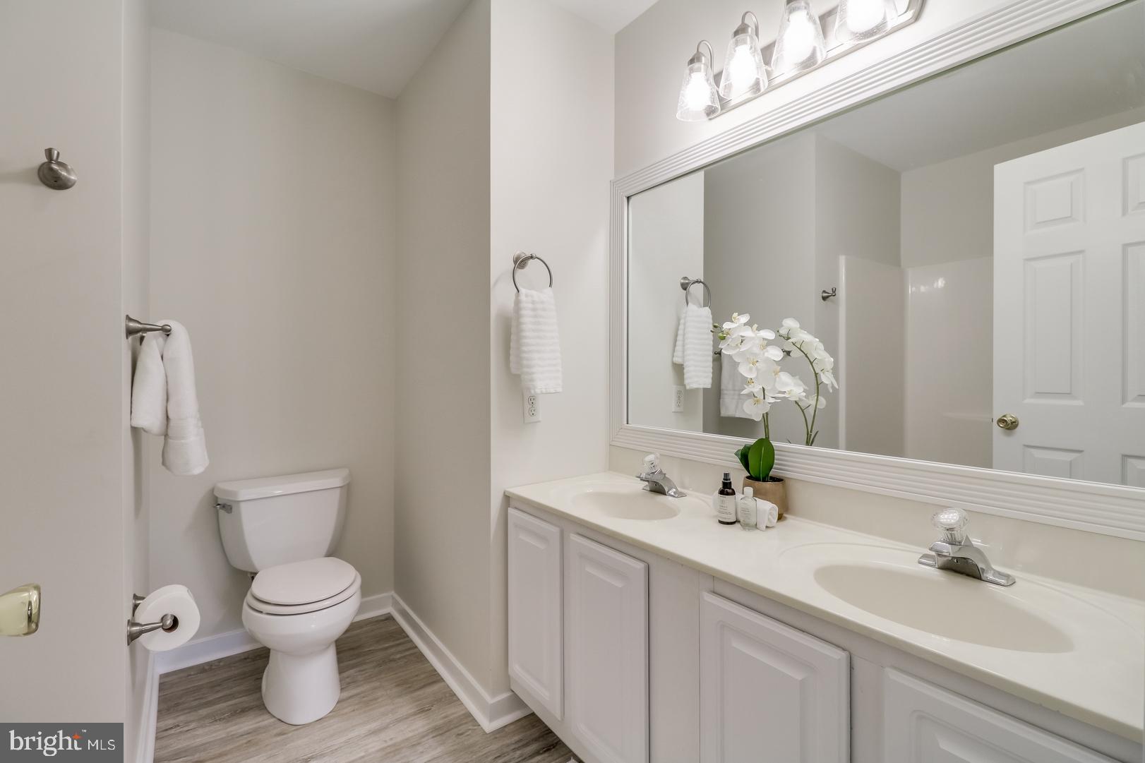 143 Cornwall Road Rehoboth Beach, DE 19971 - Photo 15 of 30 1st floor master bath w/new flooring & lighting.
