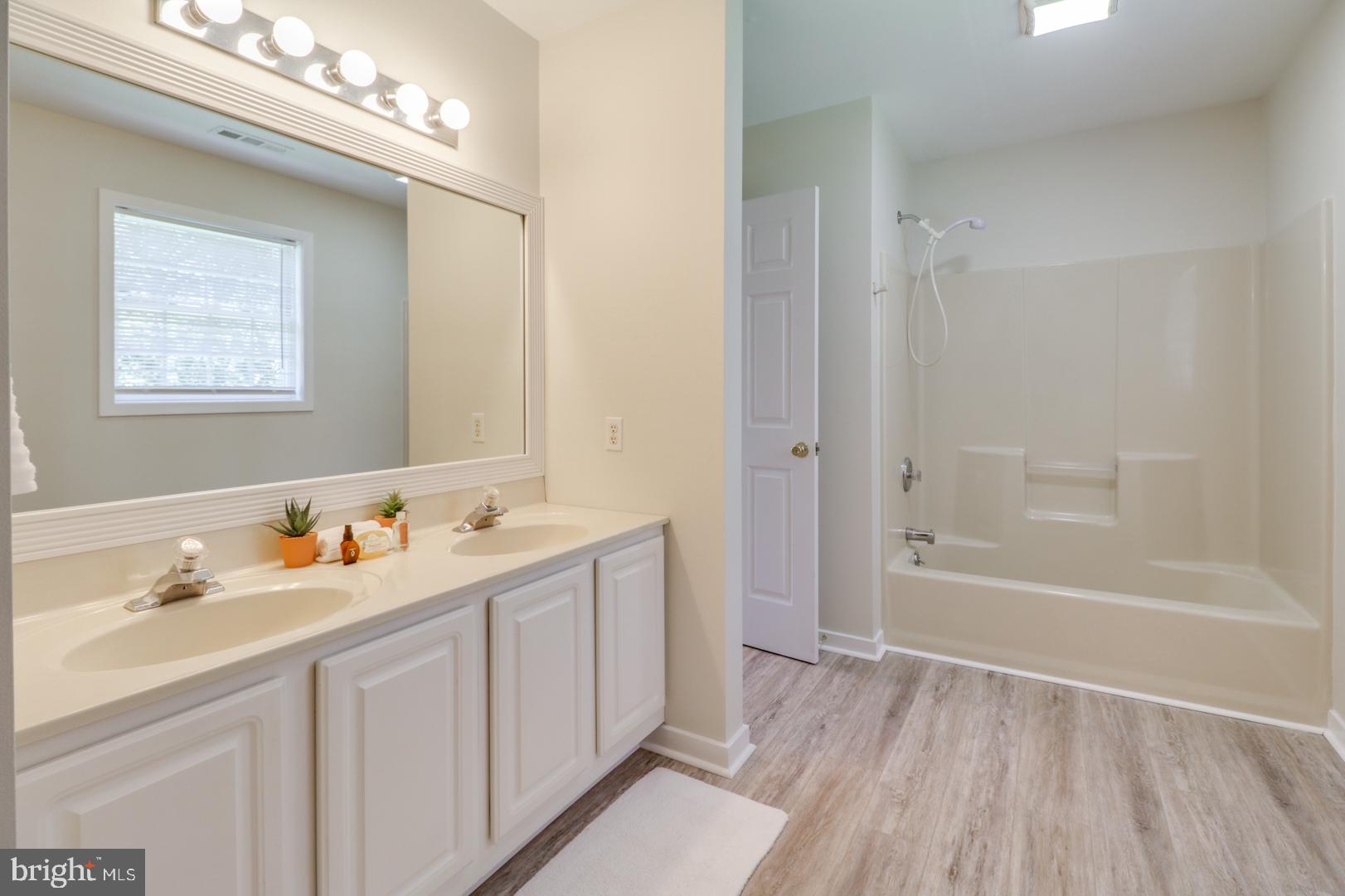 143 Cornwall Road Rehoboth Beach, DE 19971 - Photo 20 of 30 2nd floor hall bath w/new flooring & lighting.