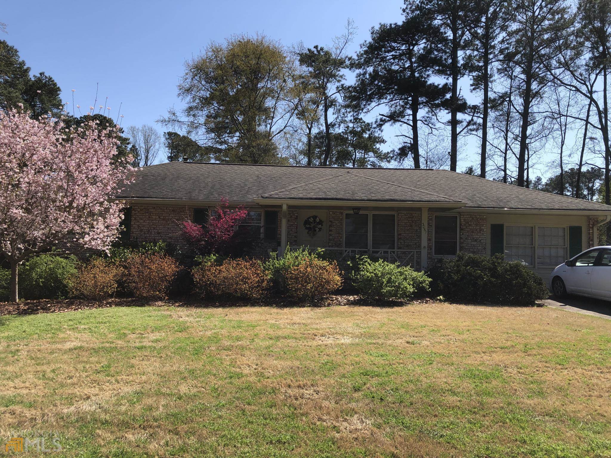 3061 Hudson Court Decatur, GA 30033 - Photo 1 of 1 a front view of a house with a yard and garage