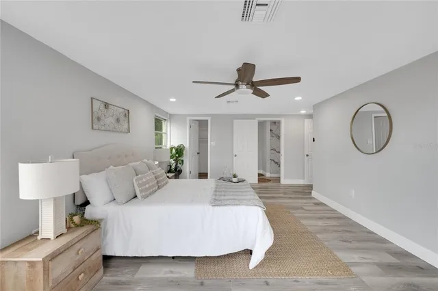 a bed room with a bed and a lamp