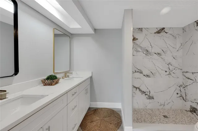 a bathroom with a sink and a mirror