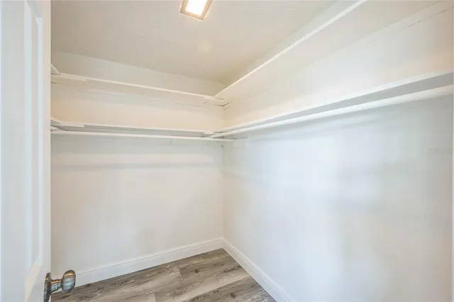 a view of an empty walk in closet