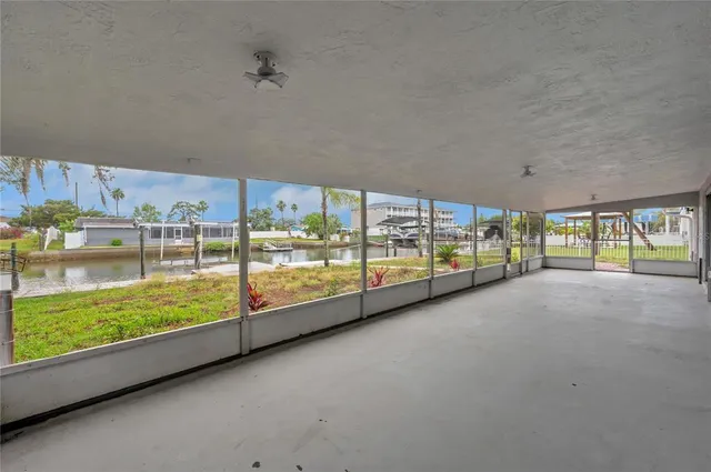 a view of a room with large windows and city view