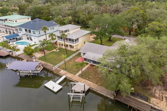 an aerial view of house with yard