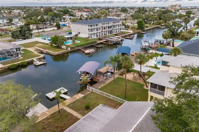 an aerial view of a house with a ocean view