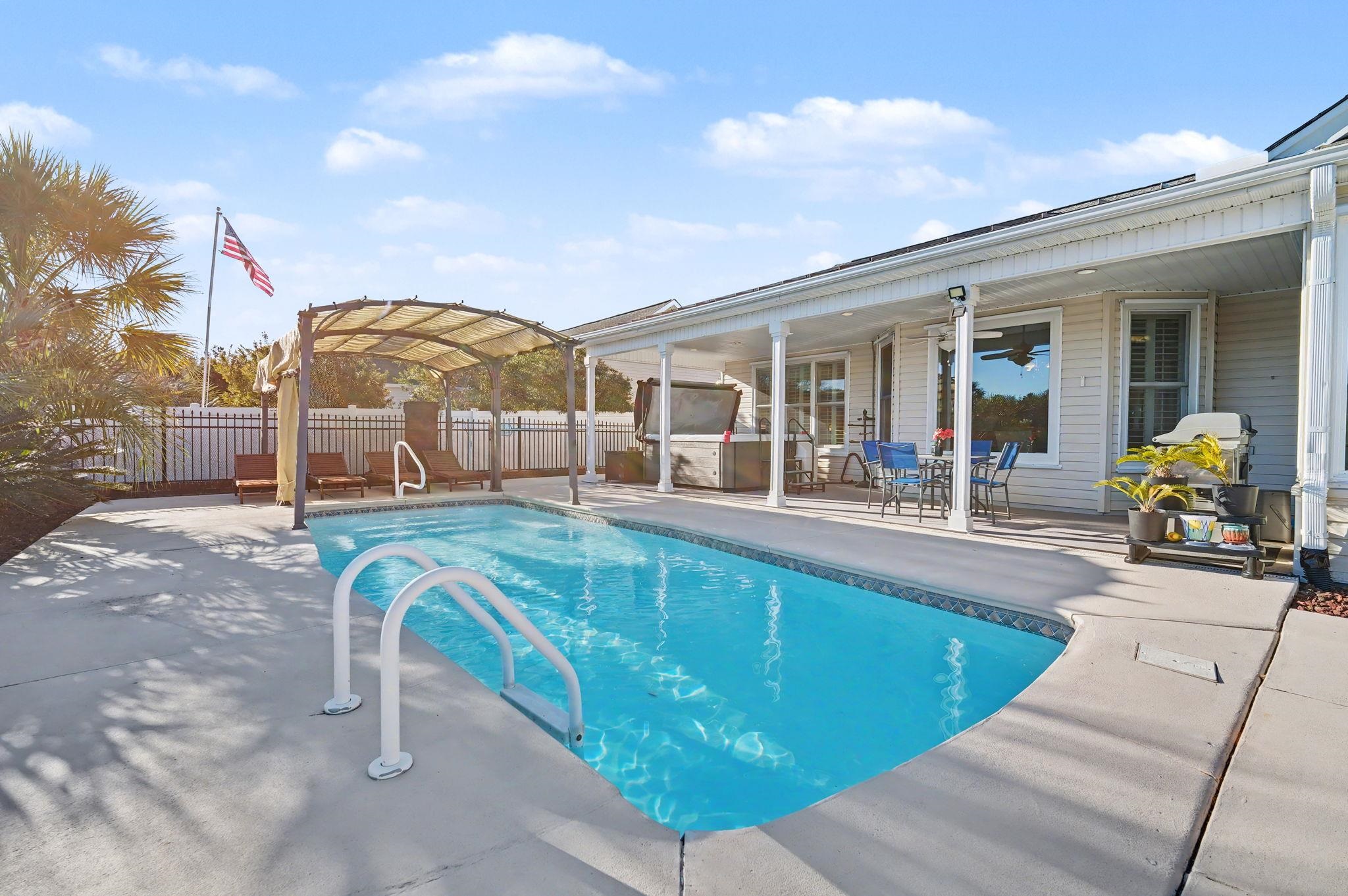 629 Cottontail Trail Myrtle Beach, SC 29588 - Photo 32 of 40 View of swimming pool with a fenced backyard, a patio, outdoor dining area, and a hot tub