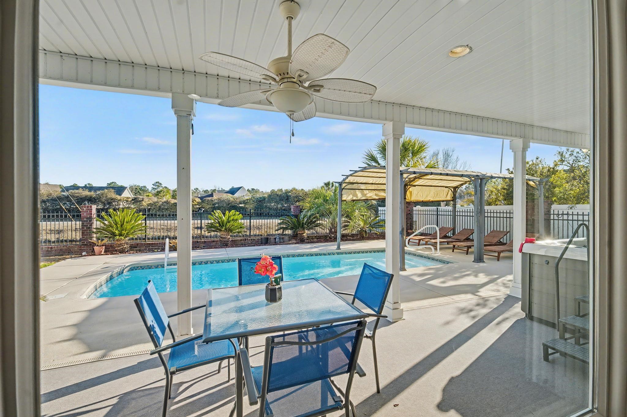 629 Cottontail Trail Myrtle Beach, SC 29588 - Photo 4 of 40 View of pool with a fenced backyard, a patio, a pergola, and outdoor dining space