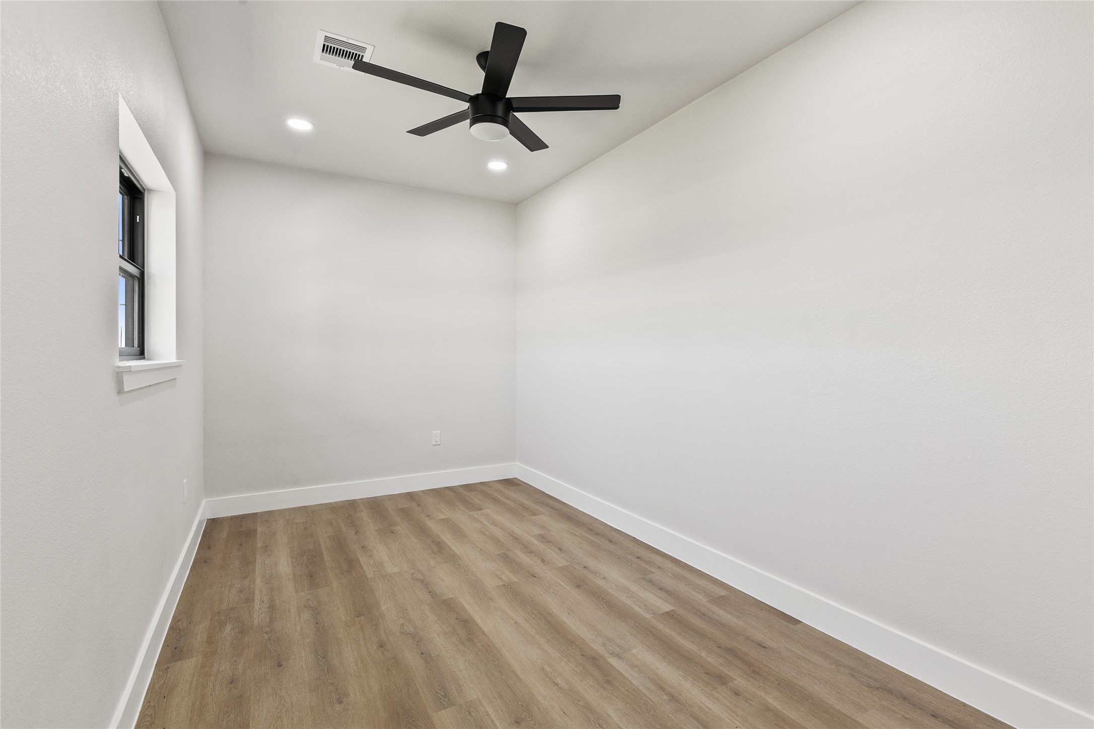 619 Chuckwagon Trail Angleton, TX 77515 - Photo 33 of 37 Dedicated home office conveniently located near the entryway and half bath, providing a quiet space for working from home, managing daily tasks, or pursuing hobbies.