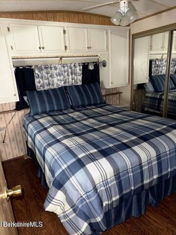 759 East North Main Road, Unit V8J Otis, MA 01253 - Photo 16 of 27 a bedroom with a bed and wooden floor