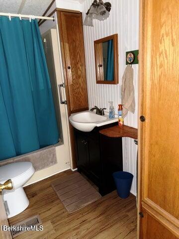 759 East North Main Road, Unit V8J Otis, MA 01253 - Photo 19 of 27 a bathroom with a sink a toilet and mirror