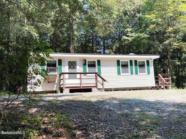 759 East North Main Road, Unit V8J Otis, MA 01253 - Photo 2 of 27 a house view with a garden space