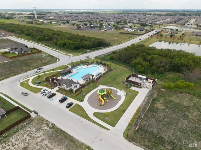 an aerial view of a house with outdoor space