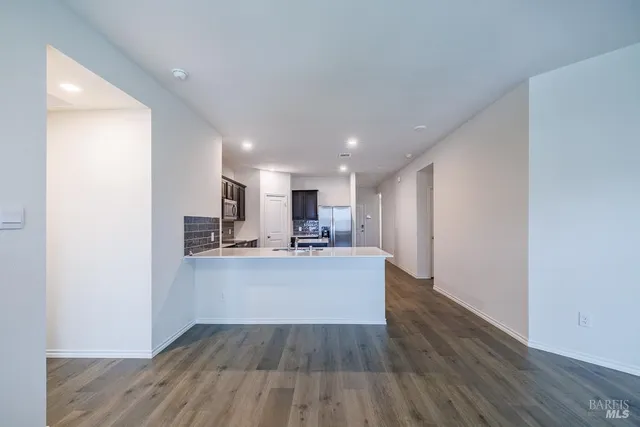 a view of kitchen with wooden floor
