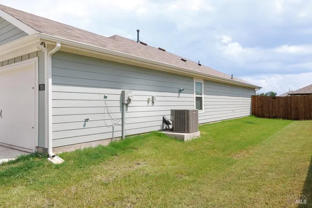 a view of a backyard with garage