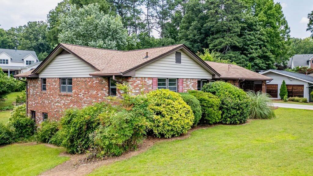 3854 Ridgewood Drive Southeast Smyrna, GA 30080 - Photo 7 of 40 a house view with a garden space