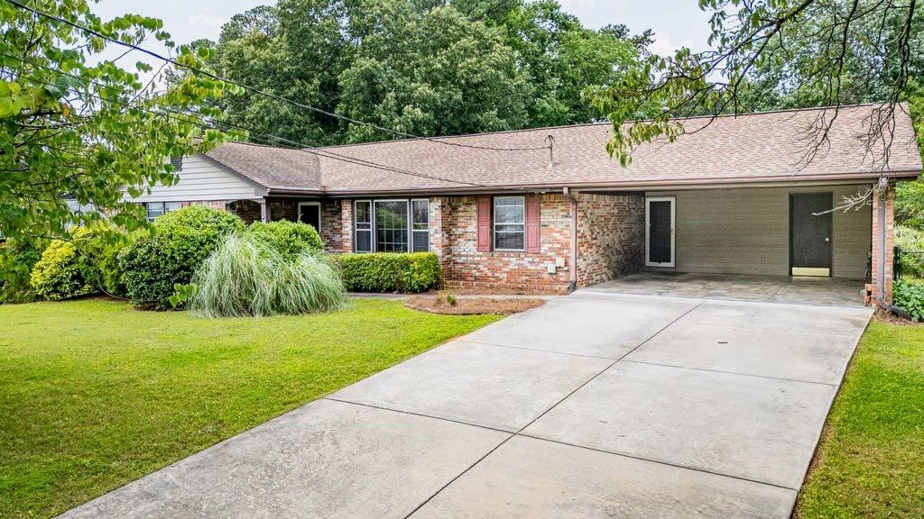 3854 Ridgewood Drive Southeast Smyrna, GA 30080 - Photo 10 of 40 a front view of a house with garden