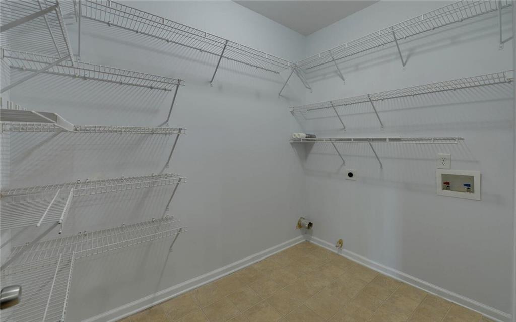 4286 Cami Way Northeast Buford, GA 30519 - Photo 12 of 39 a view of a room with racks on the wall