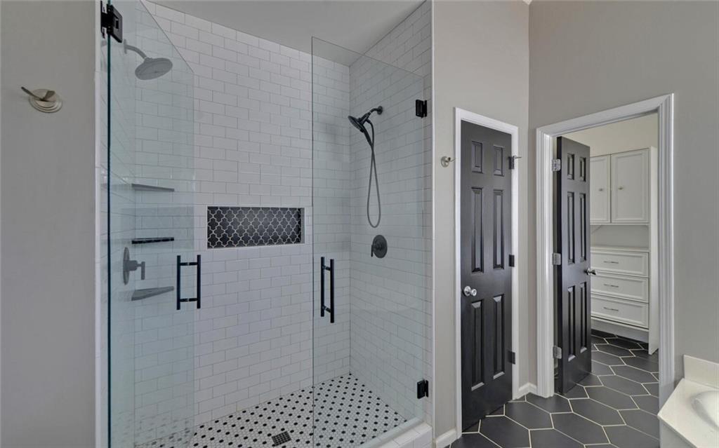 4286 Cami Way Northeast Buford, GA 30519 - Photo 18 of 39 a bathroom with a shower