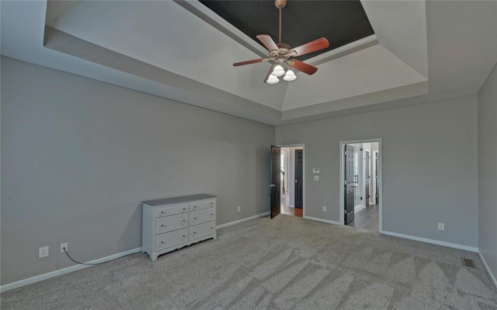 4286 Cami Way Northeast Buford, GA 30519 - Photo 21 of 39 an empty room with chandelier fan