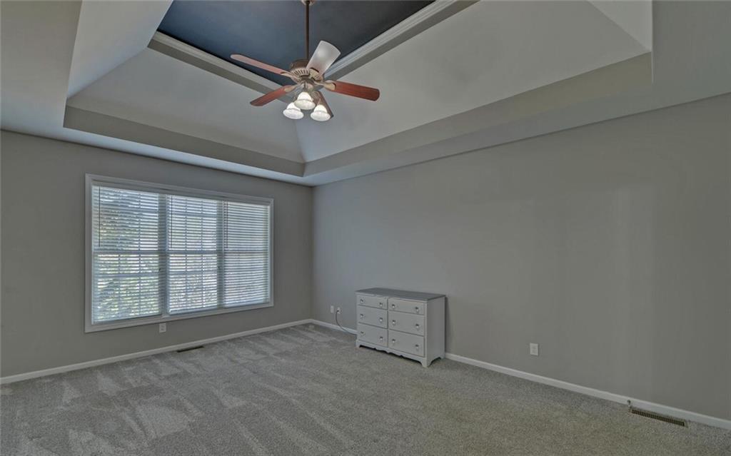 4286 Cami Way Northeast Buford, GA 30519 - Photo 22 of 39 an empty room with windows and fan