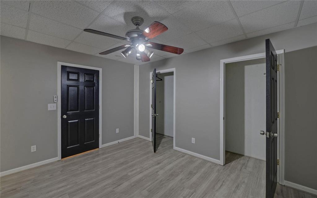 4286 Cami Way Northeast Buford, GA 30519 - Photo 30 of 39 a view of an empty room with wooden floor