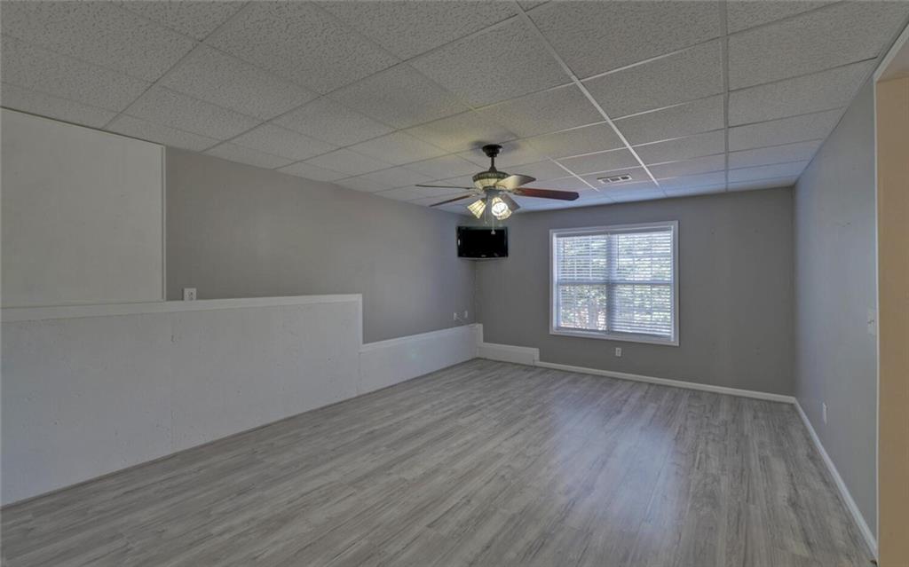 4286 Cami Way Northeast Buford, GA 30519 - Photo 33 of 39 wooden floor in an empty room with a window