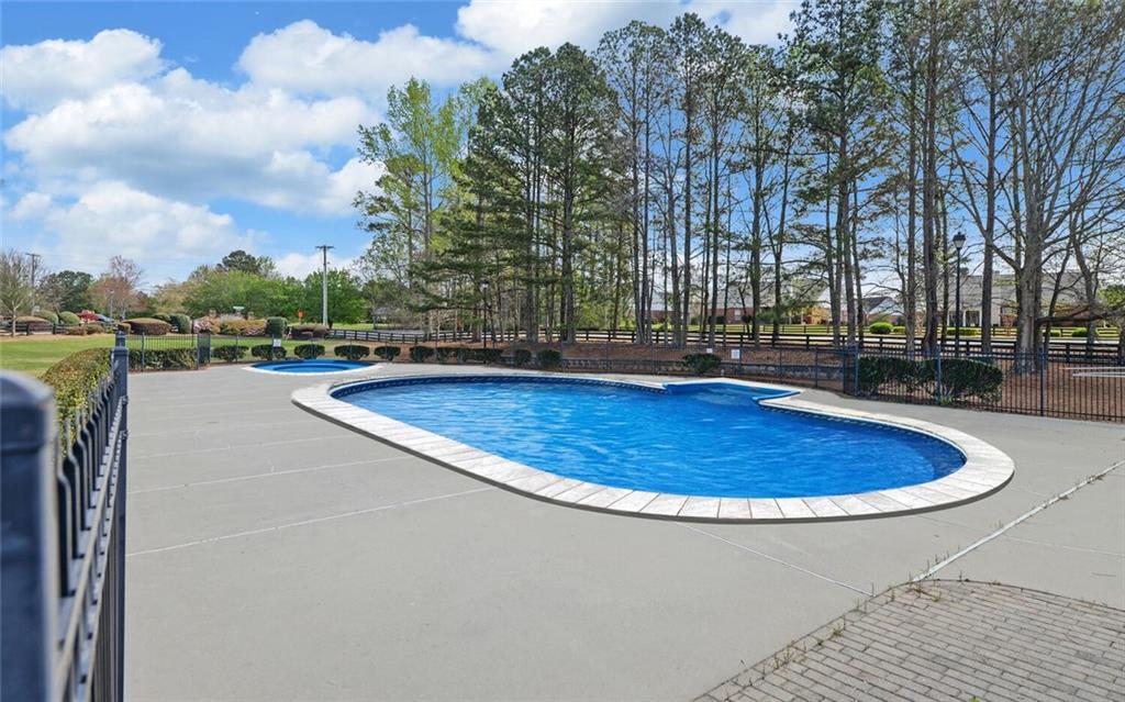 4286 Cami Way Northeast Buford, GA 30519 - Photo 35 of 39 a view of a swimming pool with a patio